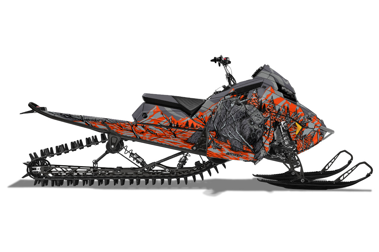 Gray Polaris snowmobile wrap with a Lynx walking in the snow with mountains and trees in the background