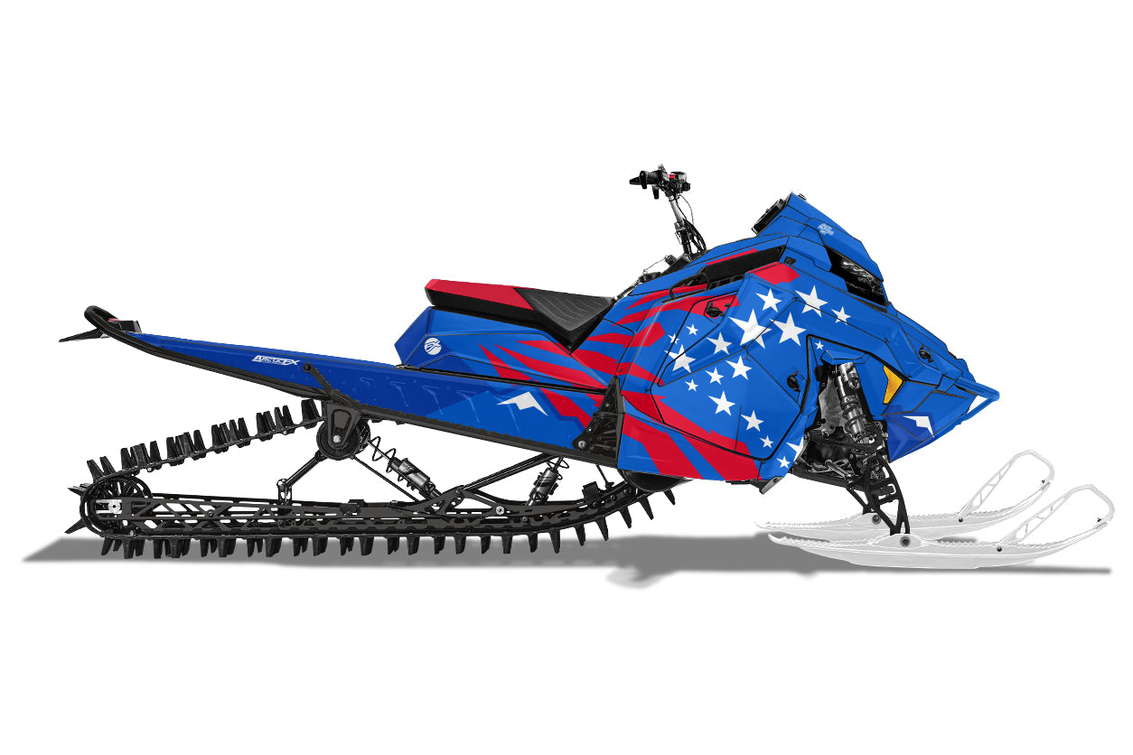 Merica snowmobile wrap in colors red white and blue and mountains in the background