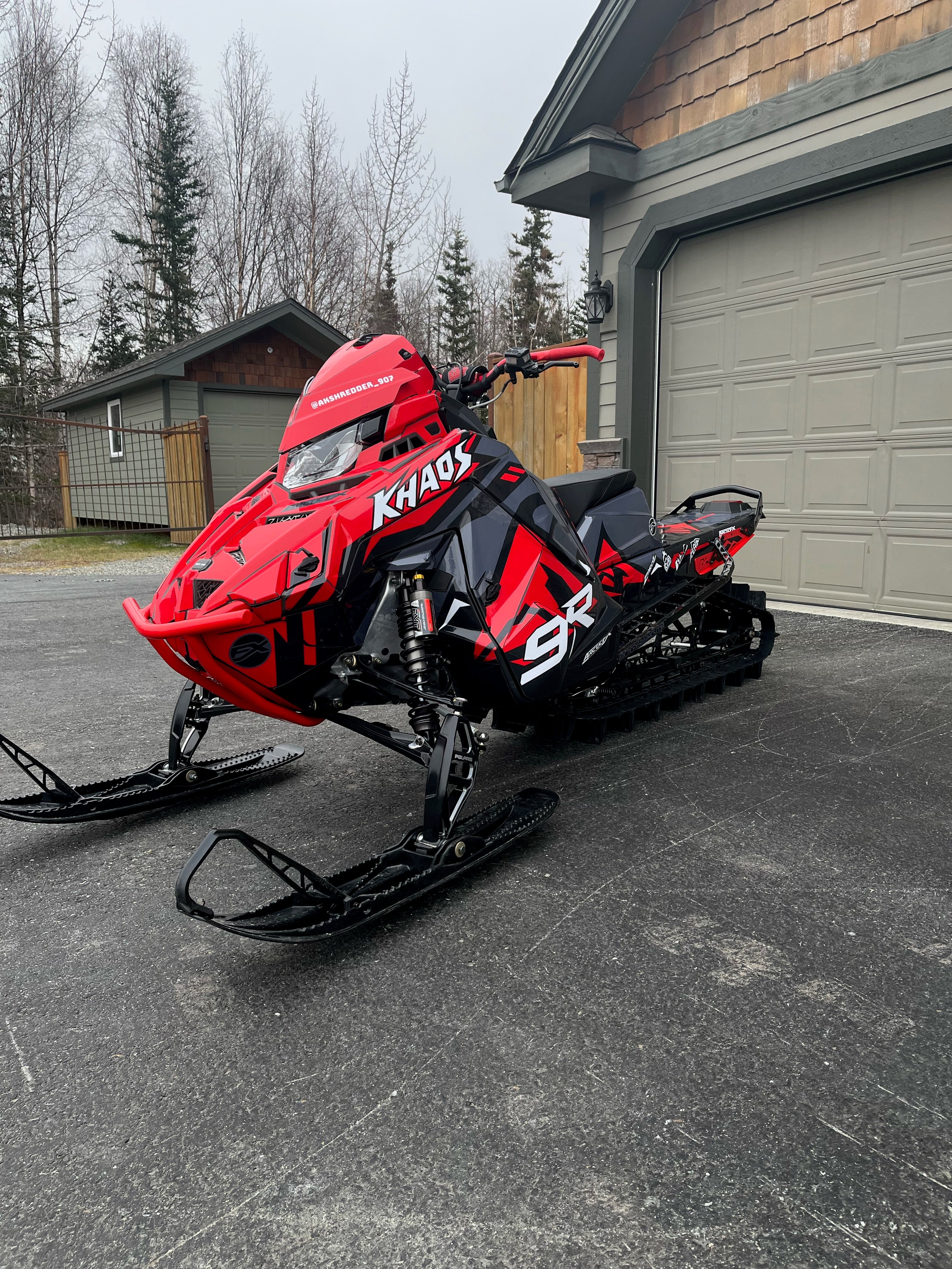 Red Polaris Snowmobile