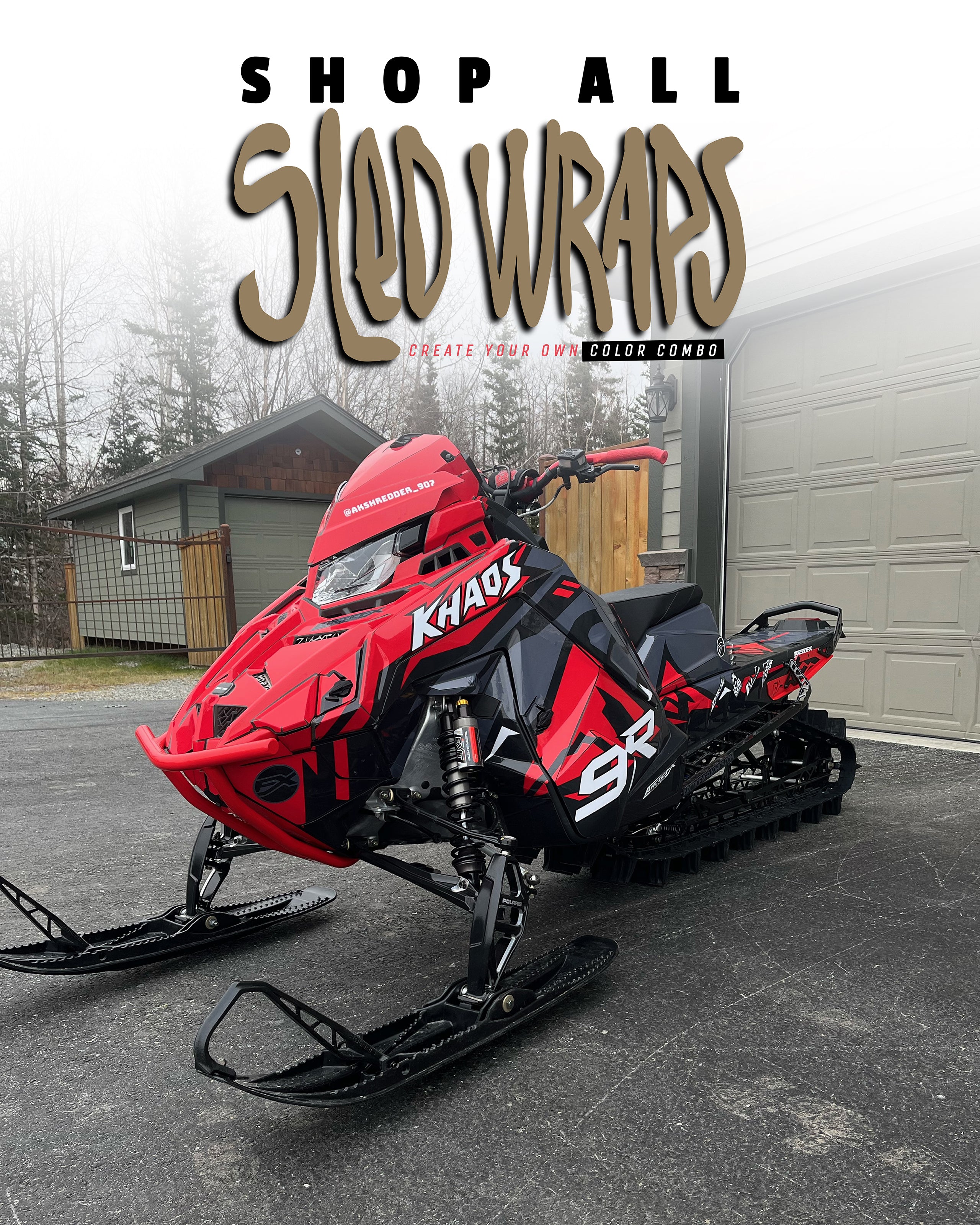 Red polaris snowmobile on the garage driveway with a mountain snowmobile wrap from ArcticFx Graphics